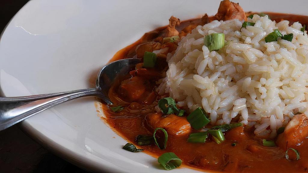 Lunch Jambalaya · Chicken, shrimp, andouille sausage, peppers, creole tomato sauce with choice of rice or pasta.
