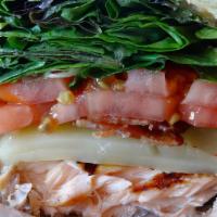 Lunch Salmon Blt · Grilled salmon, applewood smoked bacon, greens, tomatoes, swiss and chipotle mayo on brioche.