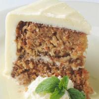 Dinner Double Layer Carrot Cake · Cream cheese frosting and creme anglaise.