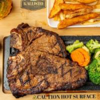 T-Bone Steak · Marinated, fire-grilled 22 oz T-bone steak served with one sauce of your choice, white mushr...