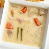 Creamy Potato Soup · Hearty new potatoes, diced carrots, onions & celery in a rich creamy base.  Served with garl...