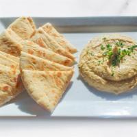 Hummus & Pita · Roasted garlic hummus and fresh pita bread