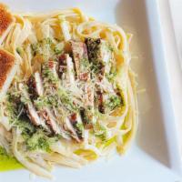 Chicken Alfredo Pasta Entree · Grilled chicken with fettuccine tossed in  alfredo sauce and topped with fresh basil pesto s...