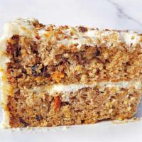 Carrot Cake Slice · A slice of carrot cake with cream cheese frosting.  Contains nuts.