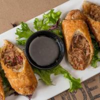 Jalapeno Brisket Rolls · Like some heat? Smoked brisket, chipotle peppers, queso and caramelized onions in a crispy
e...