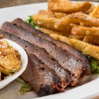 Texas Brisket · Gluten free. Caressed with our secret rub, smoked twelve hours until tender. And cut to orde...