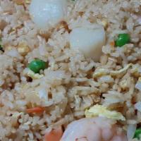 House Fried Rice · Combination fried rice with beef, shrimp and chicken.