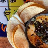 Queso Fundido · Monterey Jack and Manchego cheese melted to perfection. Topped with your choice of: chorizo,...