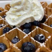 Blueberry Waffle · Waffle topped with fresh blueberries, whipped cream & sprinkled with powdered sugar.