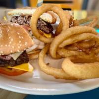 Smokehouse Burger · Seared and seasoned topped with bacon, onions and BBQ sauce over American and jack cheeses, ...