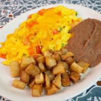 Chilaquiles Plate · Two scrambled eggs cooked with tortilla chips and pico de gallo, topped with melted cheese, ...