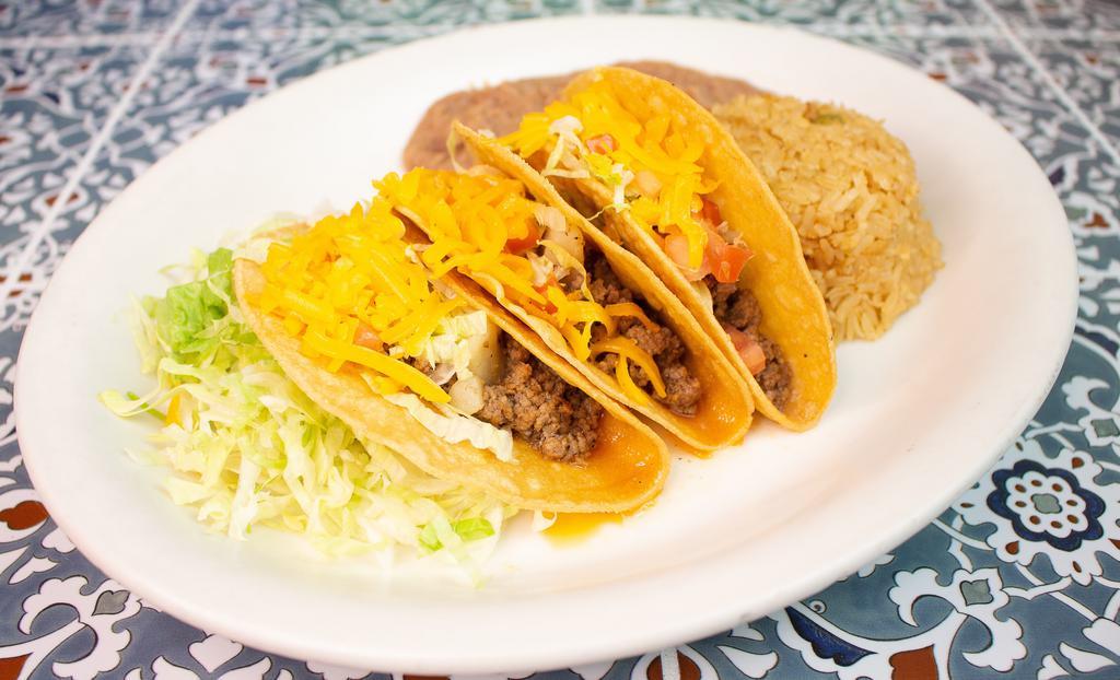 Crispy Taco Plate · Three ground beef or shredded chicken tacos with lettuce tomato and cheese. Includes rice, beans and two tortillas.