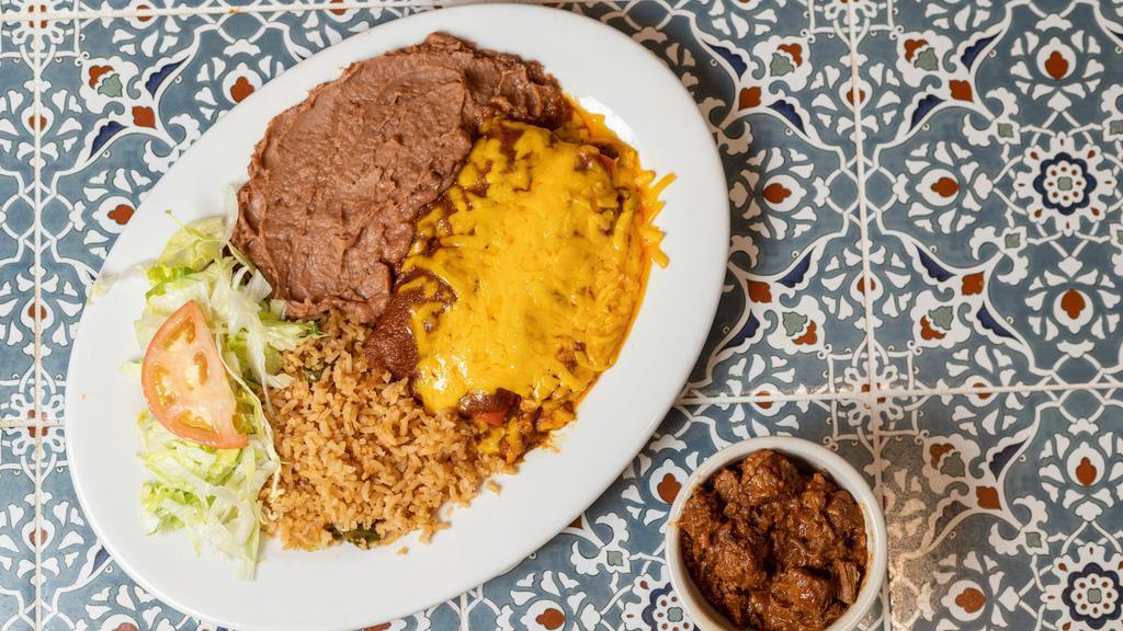 Enchiladas & Carne Guisada · Two cheese enchiladas and a portion of carne guisada with lettuce and tomato. Includes rice, beans and two tortillas.