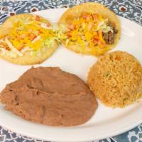 Puffy Taco Plate · Two beef or chicken puffy tacos served with lettuce, tomato and cheese. Includes rice, beans...