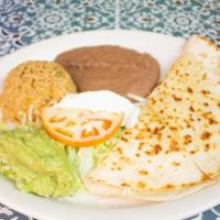 Quesadilla Plate · Large flour tortilla filled with cheese and either beef or chicken fajitas, with a side of g...