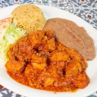 Carne De Puerco En Chile Colorado · Topped with lettuce and tomato. Includes rice, beans and two tortillas.