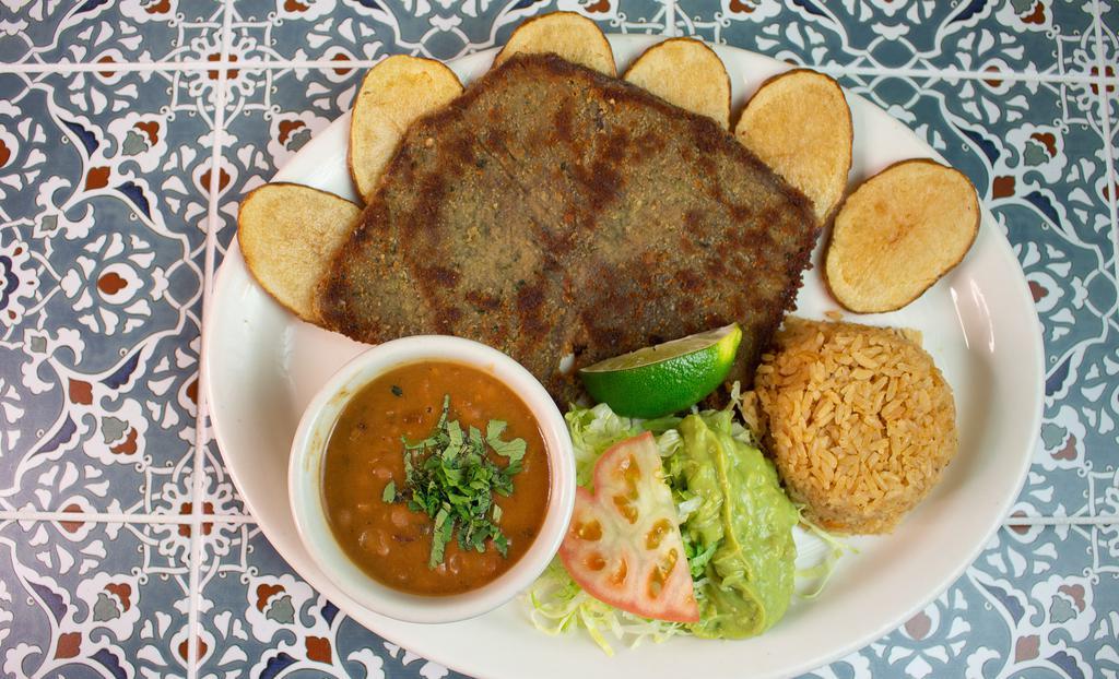 Milanesa Plate · Breaded beef steak, served with potatoes, borracho beans, and guacamole salad. Includes rice, beans and two tortillas.