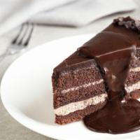 Chocolate Cake · A slice of our fresh made rich chocolate cake with a chocolate frosting.