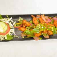 Paneer Chili Dry · Paneer and peppers stir-fried in a spicy tangy sauce.