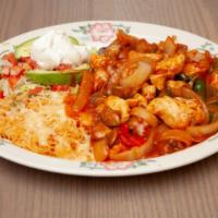 Arroz Con Pollo · Tender chicken stripe prepared in a special mild sauce with mushrooms, green peppers, and on...