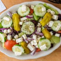 Greek Salad · Iceberg lettuce, Roma tomatoes, cucumbers, pepperoncini, kalamata olives, red onions, feta c...