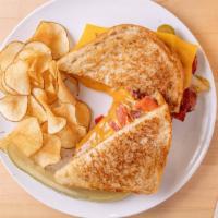 Pastrami Melt · Pastrami, mayo, mustard cheddar cheese, sauteed onions and peppers on grilled sourdough bread.