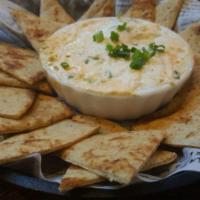 Parmesan Cheese Dip · A warm blend of Parmesan, cheddar and cream cheese with roasted garlic and green onions acco...