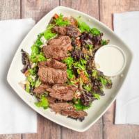 Steak Salad · Crisp mixed greens, seasoned steak, smoked bacon, tomatoes, onions and bleu cheese crumbles,...