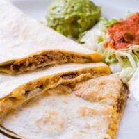 Pork Quesadillas · Fresh flour tortillas grilled and filled with cheddar jack cheese and roasted pulled pork. S...