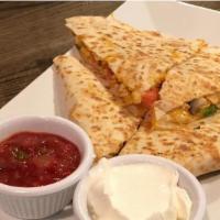 Chicken Quesadillas · Tomatoes, onions, mushrooms, peppers, served with sour cream and salsa.