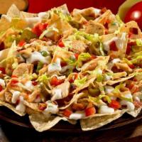 Southwest Chicken Nachos · Crispy chicken, jalapenos, cheddar cheese, onion, Applewood bacon and guacamole served with ...