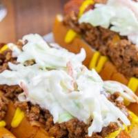 Freddys Carolina Slaw Dogs · Freddy's Carolina-Style Slaw Dogs are topped with mustard, homemade Chicken chili, and a coo...