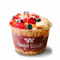 Acai Bowl  · Organic Açaí base. Topped with granola, strawberries, banana, blueberries, coconut shavings,...
