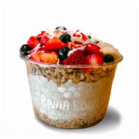 Oatmeal Bowl · Whole grain oatmeal, granola, strawberries, banana, blueberries, coconut flakes, and honey.