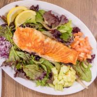 Salmon Salad · 8 oz grilled fresh Atlantic salmon on a bed of baby greens with cucumber and tomato. Italian...