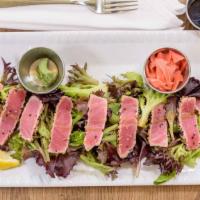 Sesame Crusted Ahi Salad · Delicately seared sesame-crusted ahi tuna on spring mixed greens, with a balsamic glaze. Ser...