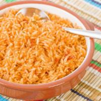 Arroz/Rice · Our fluffy rice cooked with our special blend of seasonings.