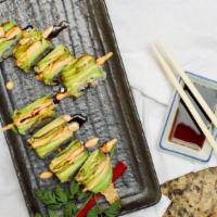 Green Dragon Roll · shrimp tempura, crab stick, cucumber, avocado, unagi sauce, spicy sauce.