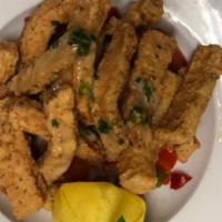 Calamares Fritos · Marinated and deep-fried calamari served with lemon butter sauce, capers, green onions and d...