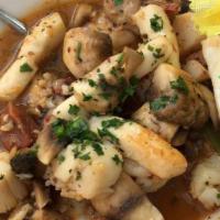 Meson Especial · Spanish chorizo, shrimp, calamari, scallops and mushrooms. Grilled and seasoned with garlic ...