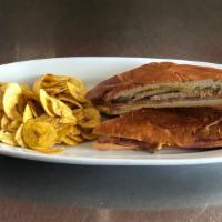Sandwich Cubano Grande · Pork, ham, swiss cheese, pickles, lite mustard and mayo, pressed on Cuban bread.