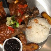 Chilindron De Cordero · Tender meaty lamb shank slowly braised in a rich merlot wine sauce and vegetable mirepoix. S...
