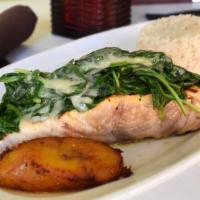 Salmon Ala Parrilla · Gluten free. Fresh north Atlantic salmon seasoned and grilled, topped with sautéed baby spin...