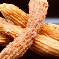 Churros · These Churros won't Disappoint. Rolled in Cinnamon & Sugar and or Filled with Nutella. Get D...