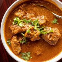 Lamb Rogan Josh · Tender juicy lamb pieces cooked traditional Indian spices.
