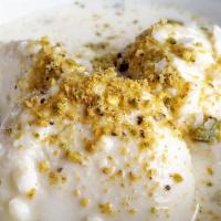 Rasmalai · Homemade cheese in chilled sweet milk with cardamom and pistachio.