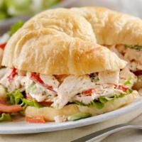 Chicken Salad Croissant · Made with Diced White Chicken, celery, onions, mayo and lettuce on a fresh made croissant.