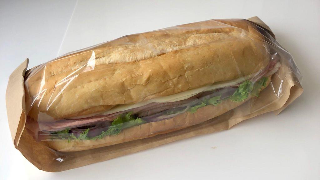 3 Meat Hoagie · 9 Inch Turkey, Ham, Salami and Provolone  Cheese with Lettuce and Red onions on Soft Hoagie Roll. Dressing packet included.