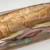 Italian Hoagie · 9 Inch Ham, Salami and Provolone with  Lettuce and Red onions on Soft Hoagie Roll. Dressing ...
