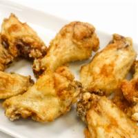 Chicken Wings · Six pieces. Crispy golden brown chicken seasoned with garlic and butter - served with sweet ...